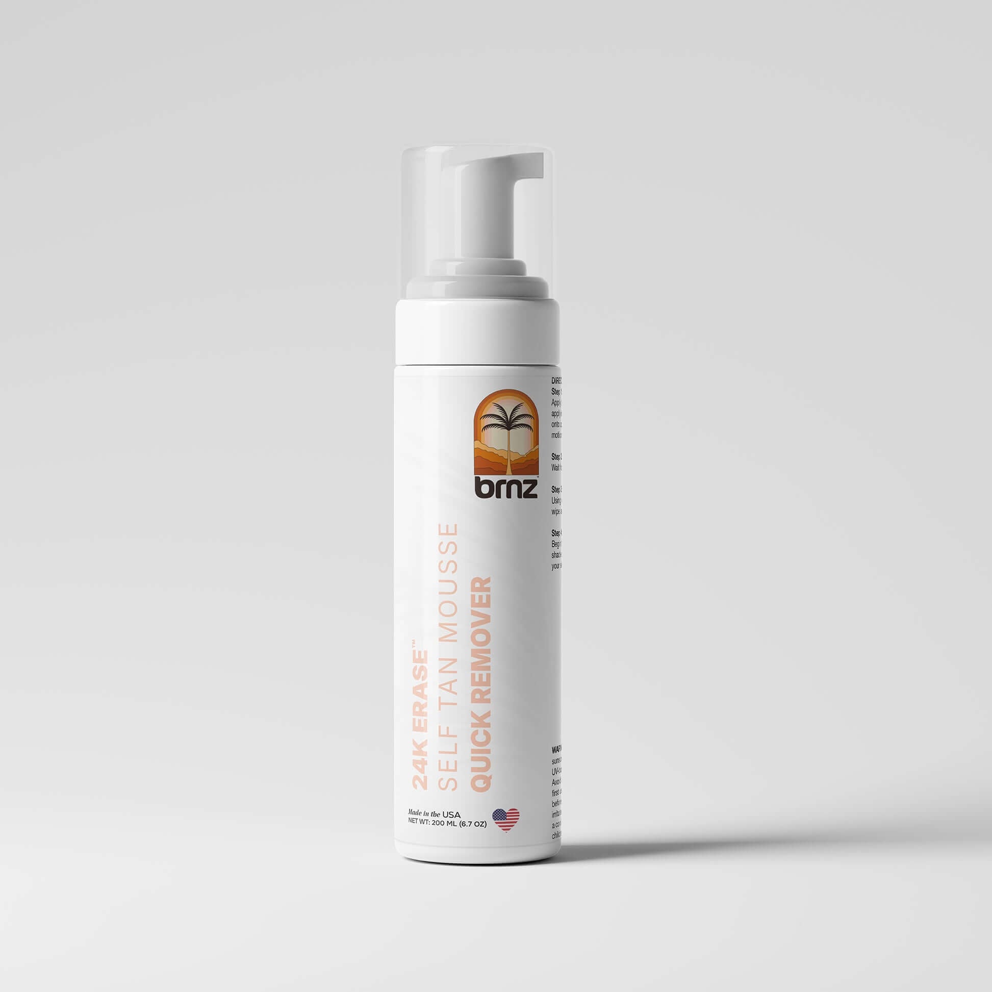 24K Erase self-tan mousse quick remover in a sleek bottle for effortless skin cleansing and smoothness.